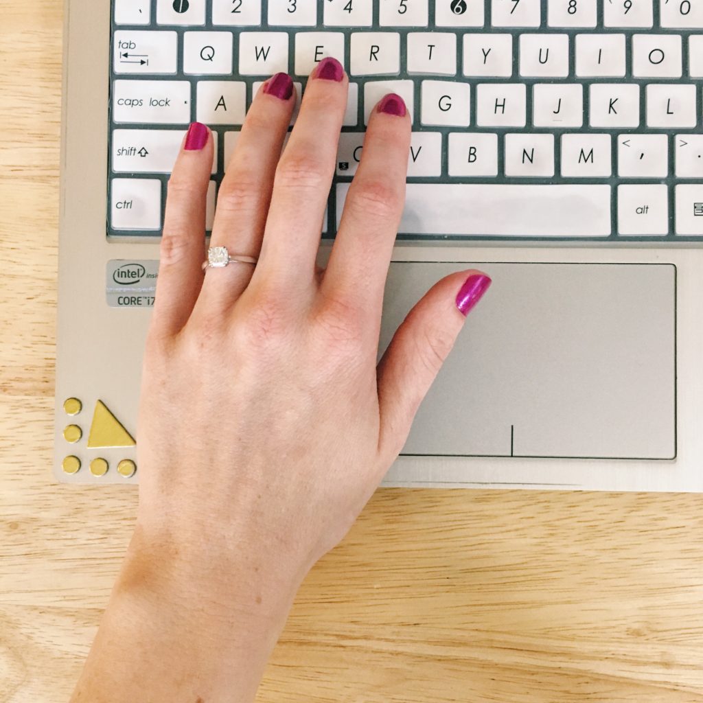 hand typing laptop